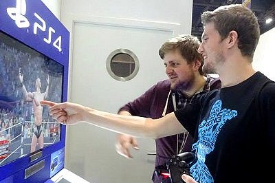 Tim looks on at demonstration of PS4>